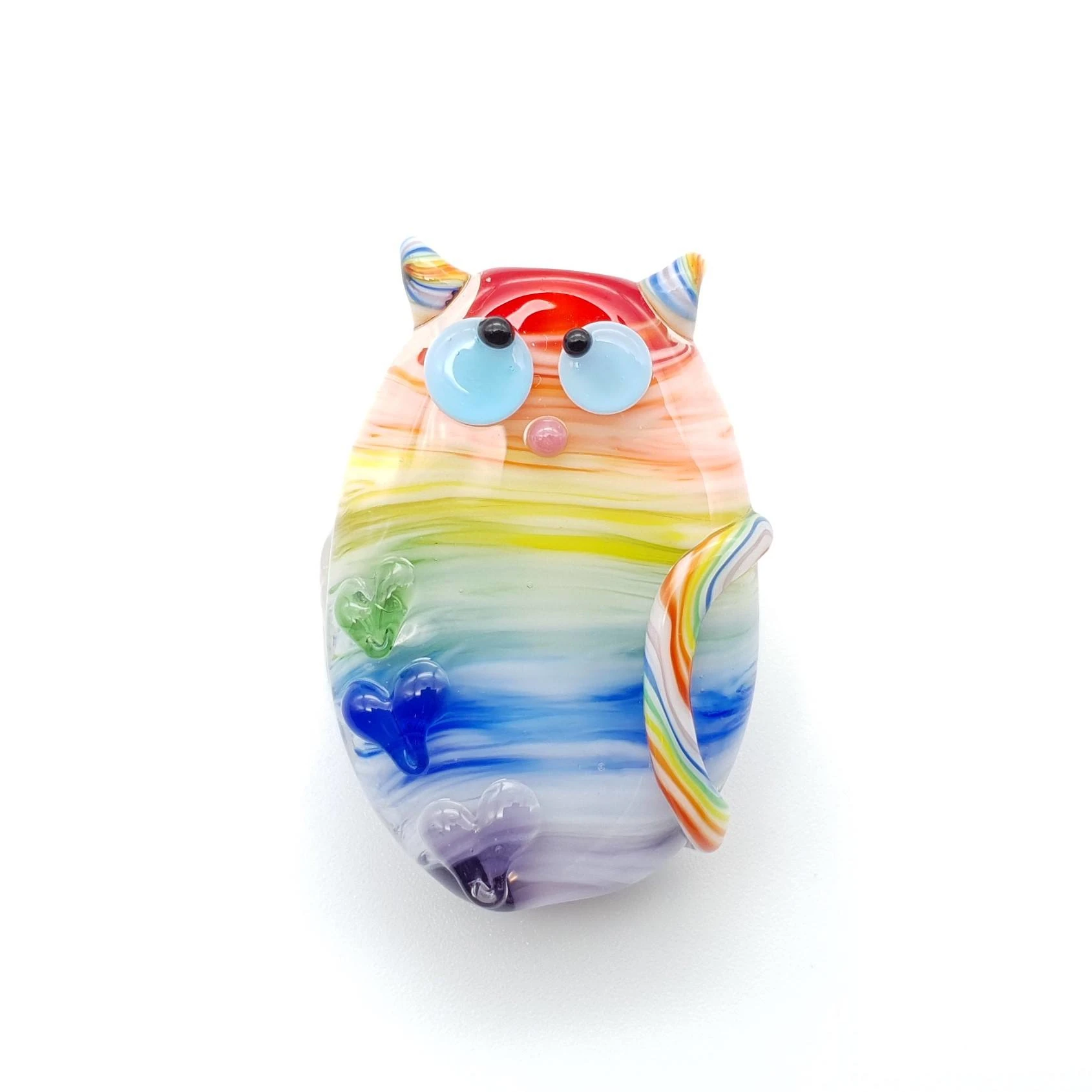 Lampwork glass bead cat, with rainbow swirls and twisted rainbow stripes on the tail. Decorated with hearts.